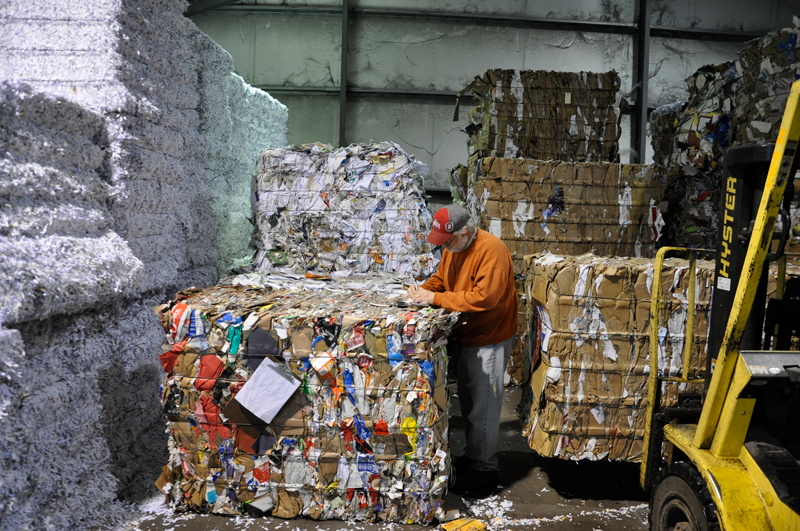 Recycled paper plant where paper is being recycled to make recycled paper that can be used in your brochure print orders.